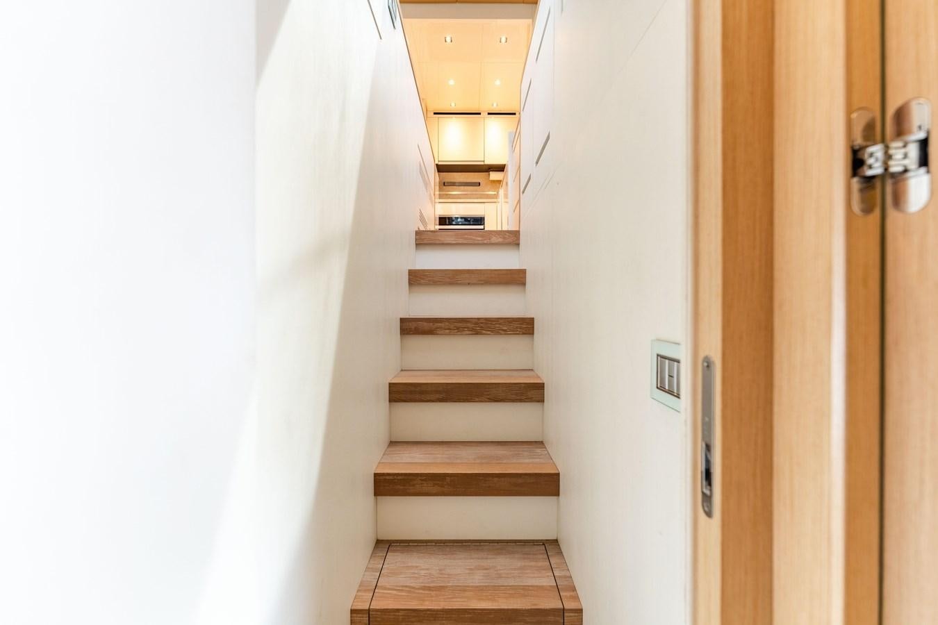 a hallway with white walls aboard 2018 SANLORENZO SL78 Yacht for Sale