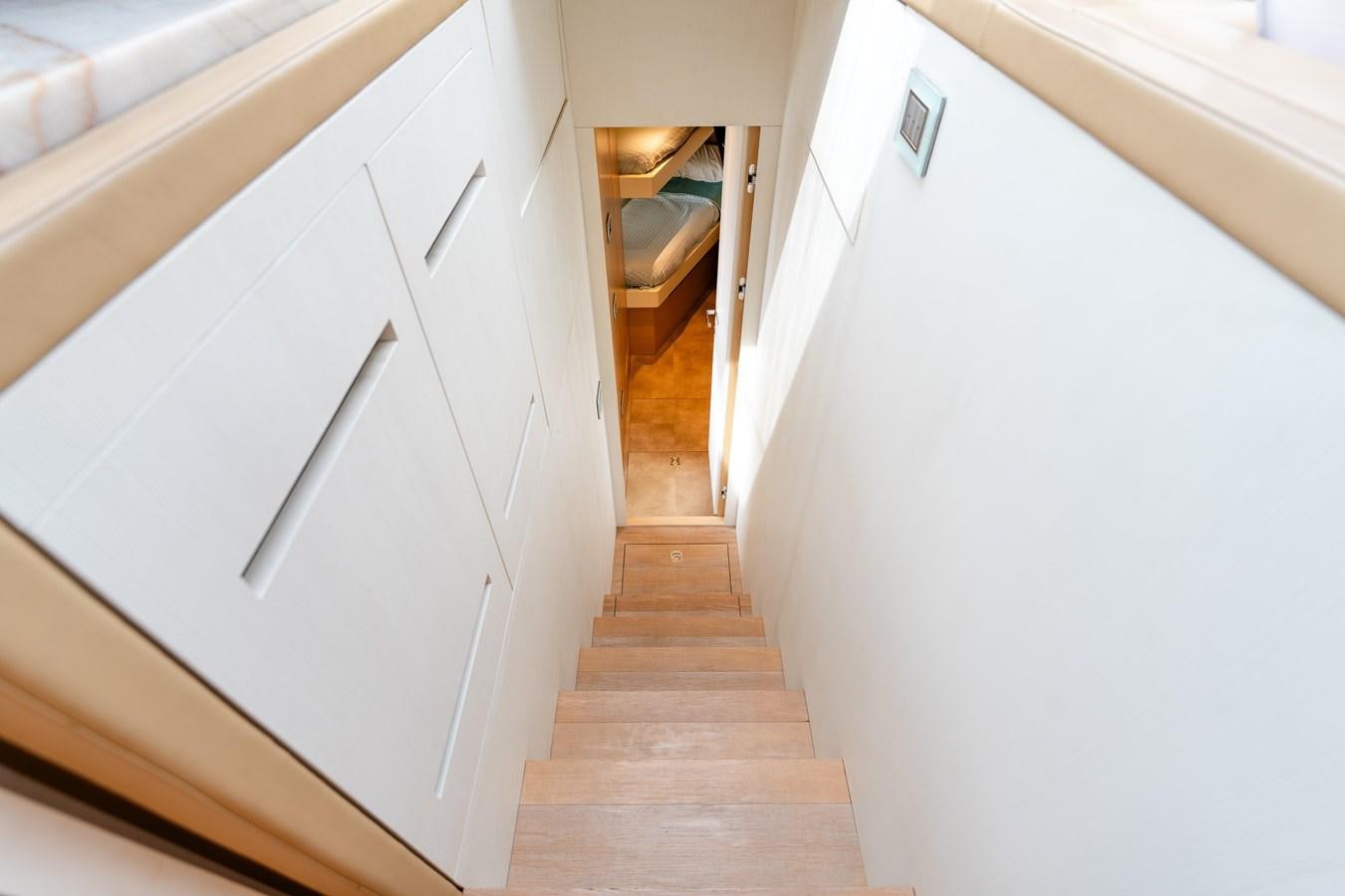 a hallway with white cabinets aboard 2018 SANLORENZO SL78 Yacht for Sale