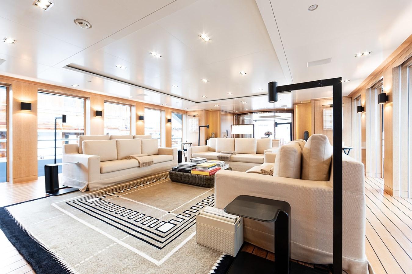 a living room with a large mirror aboard BELONGERS Yacht for Sale