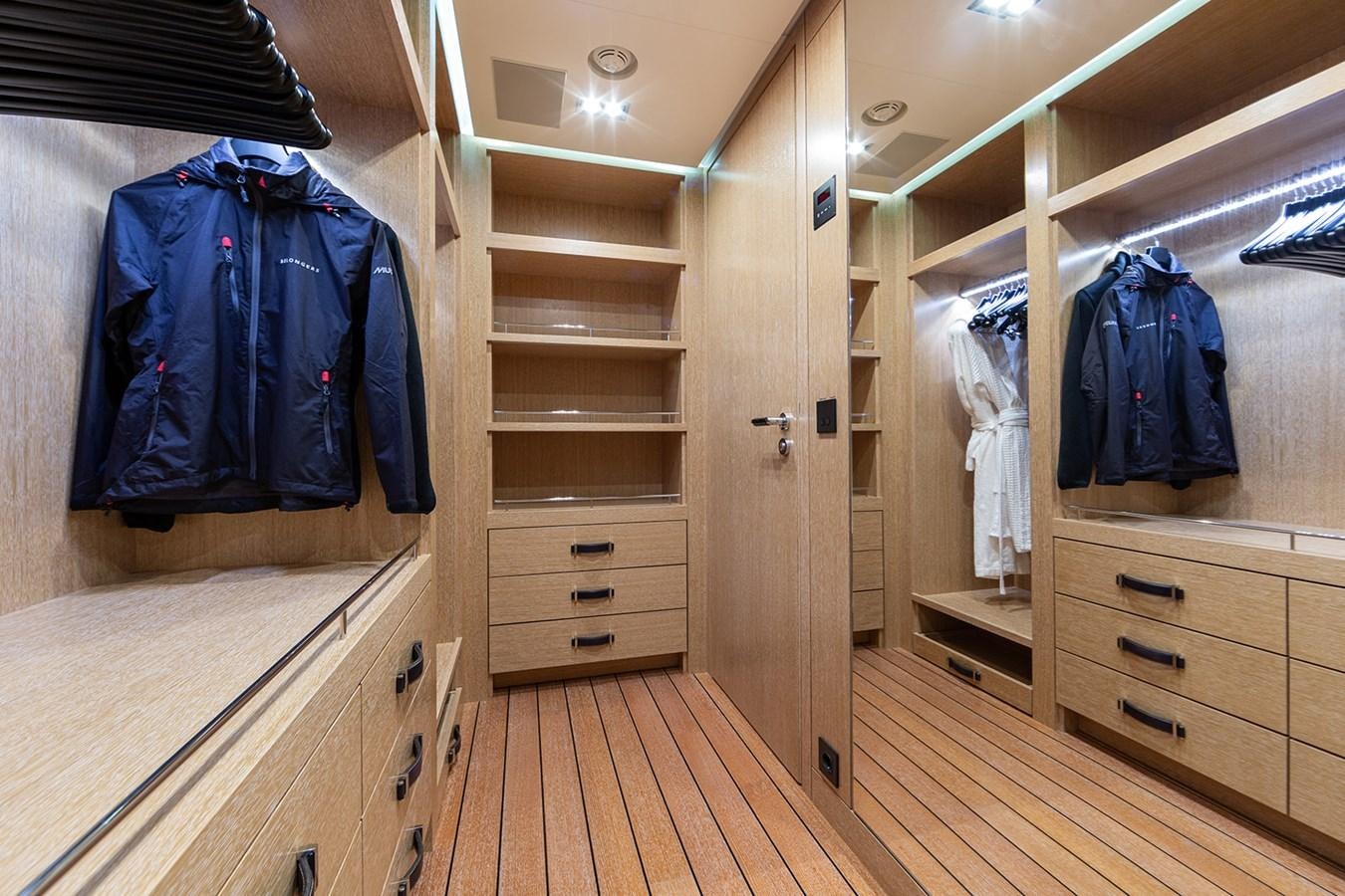 a room with a closet and a bed aboard BELONGERS Yacht for Sale