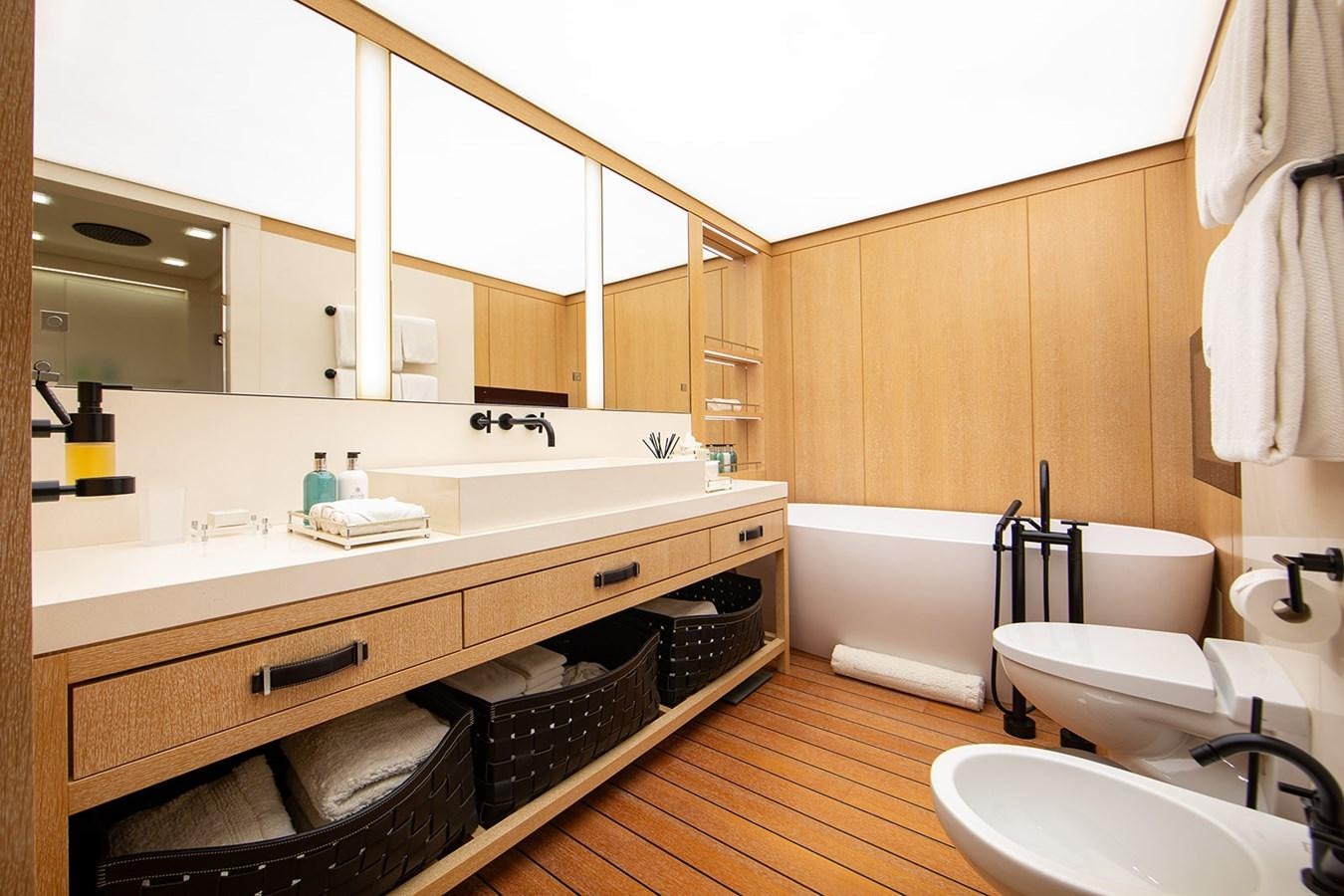 a bathroom with a tub sink and toilet aboard BELONGERS Yacht for Sale