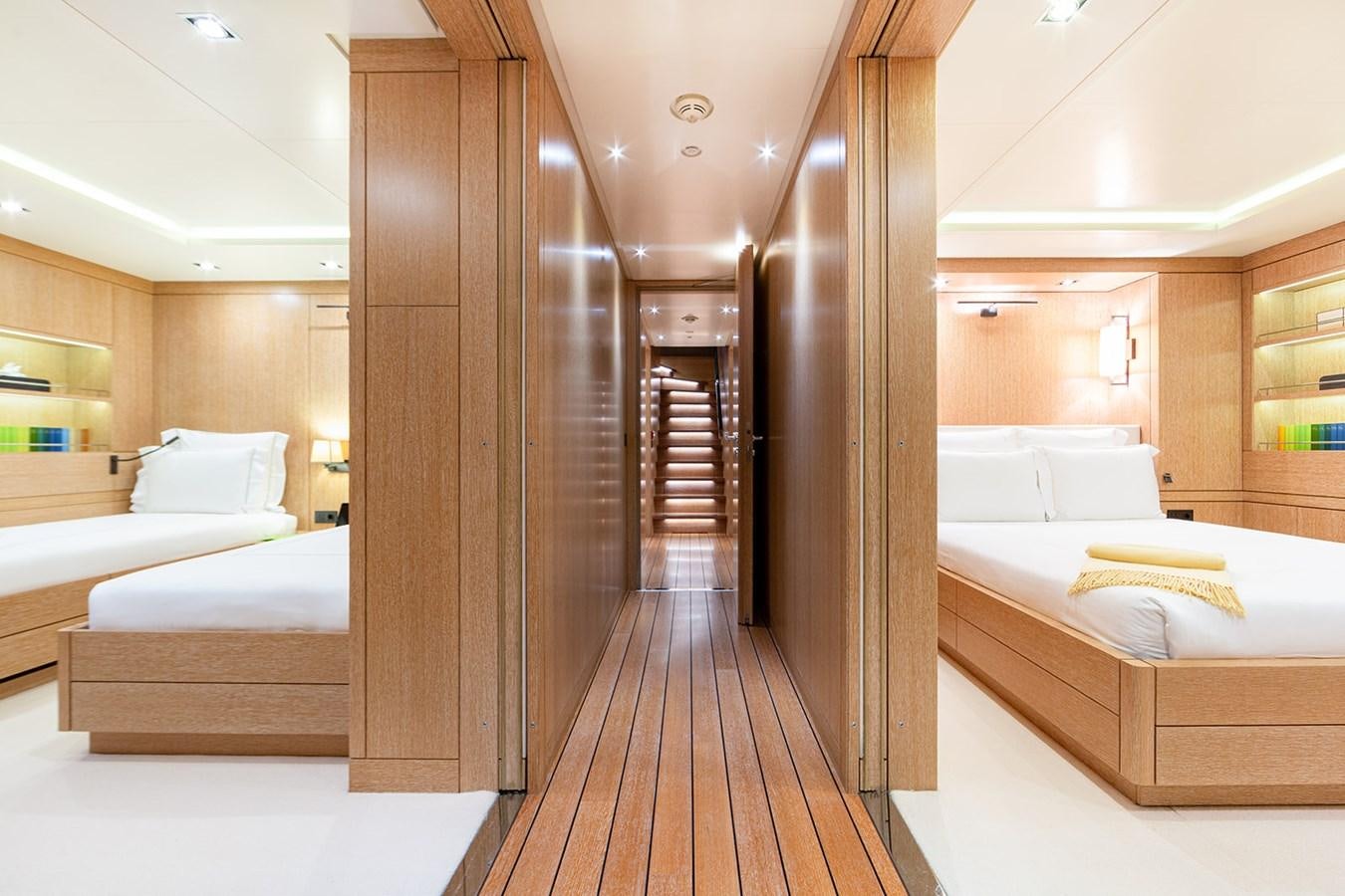 a room with a bed and a closet aboard BELONGERS Yacht for Sale