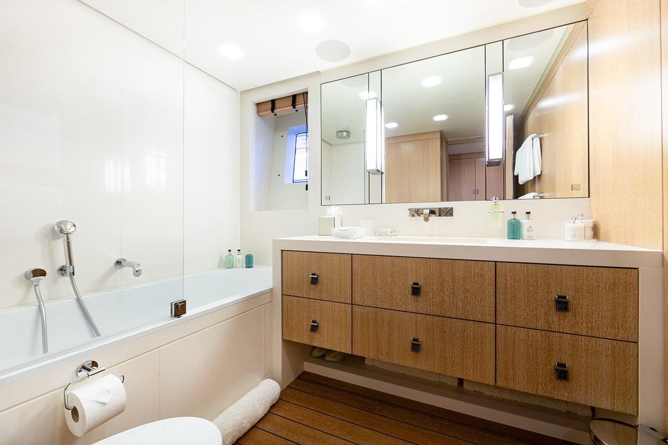 a bathroom with a large mirror aboard BELONGERS Yacht for Sale