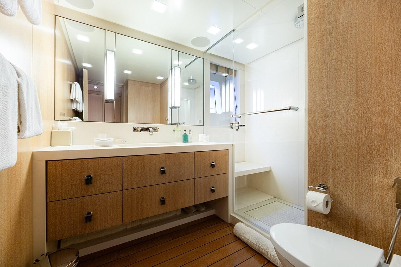 a bathroom with a large mirror aboard BELONGERS Yacht for Sale