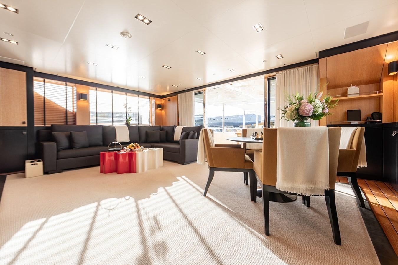 a living room with a couch and a table aboard BELONGERS Yacht for Sale