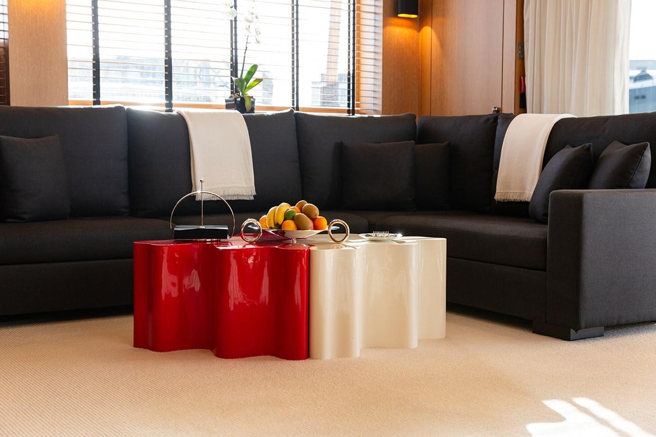 a living room with a couch and a coffee table aboard BELONGERS Yacht for Sale