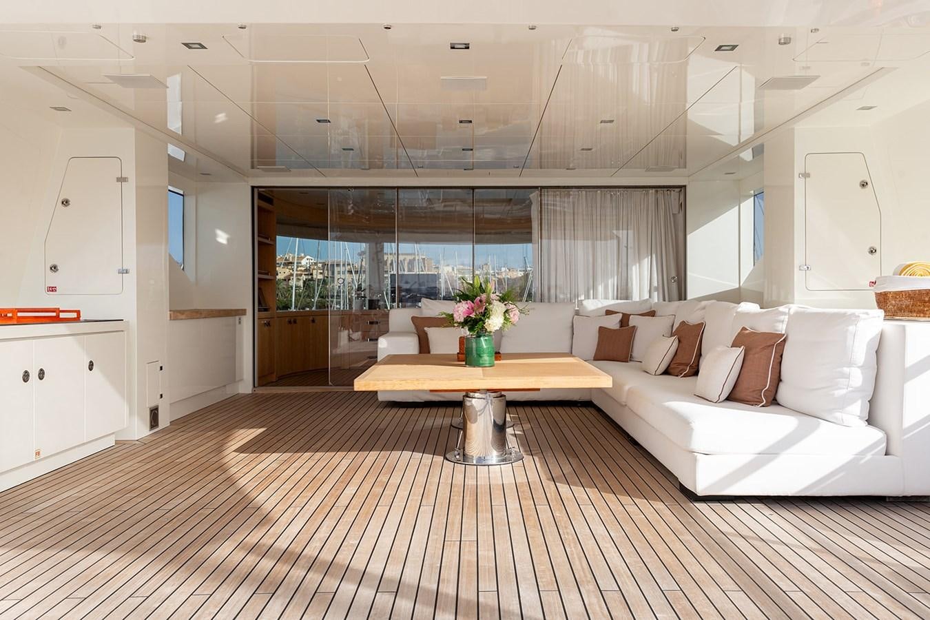 a room with a couch and a table aboard BELONGERS Yacht for Sale