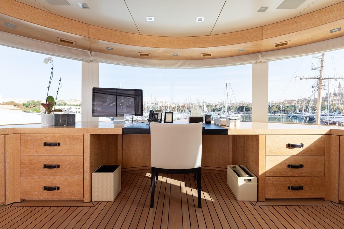a room with a desk and a chair aboard BELONGERS Yacht for Sale
