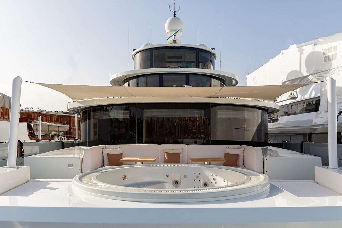 a large white building with a swimming pool aboard BELONGERS Yacht for Sale