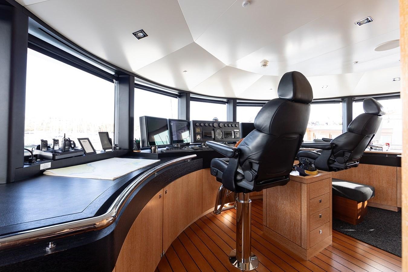 a black chair in a room aboard BELONGERS Yacht for Sale