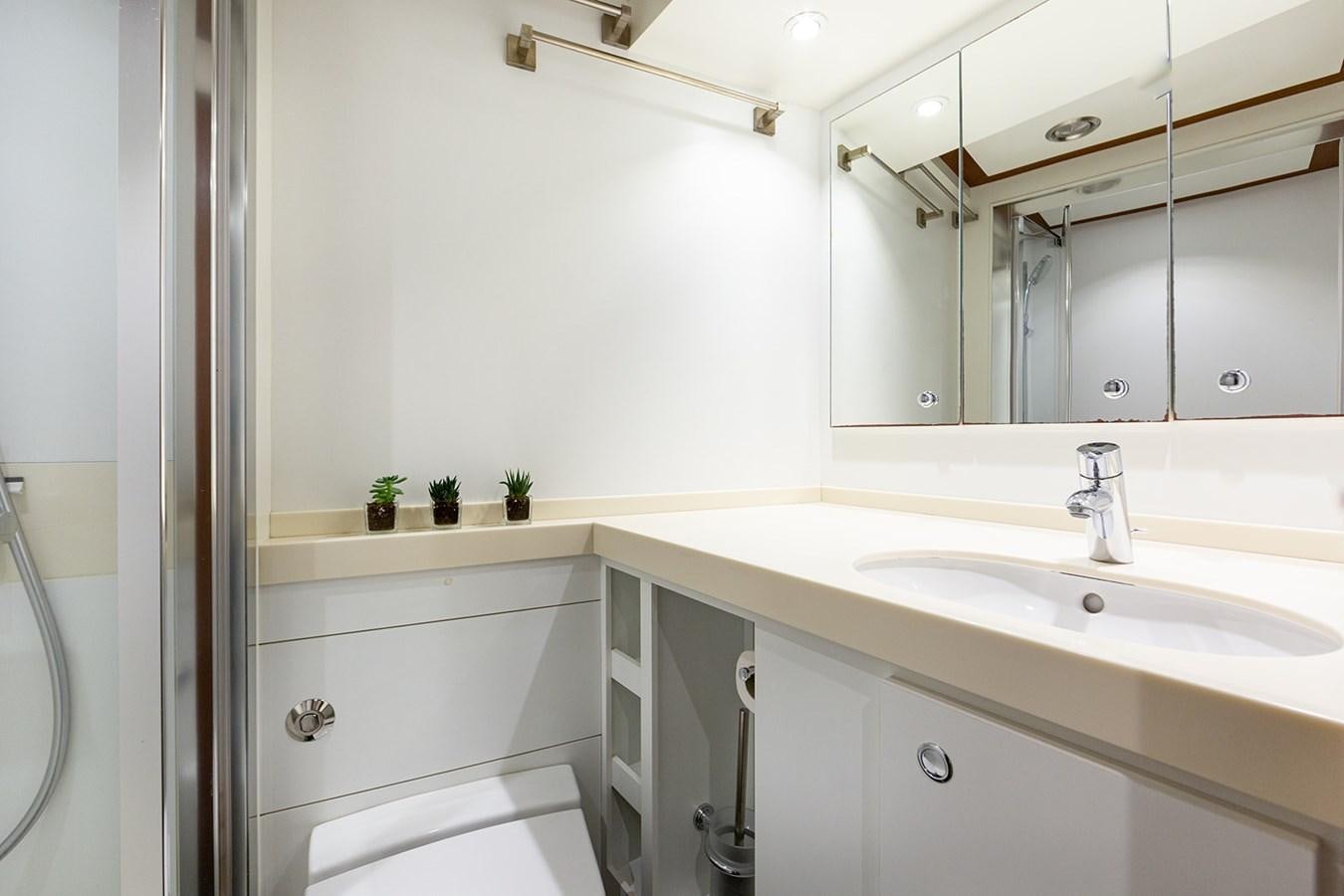 a bathroom with a large mirror aboard BELONGERS Yacht for Sale