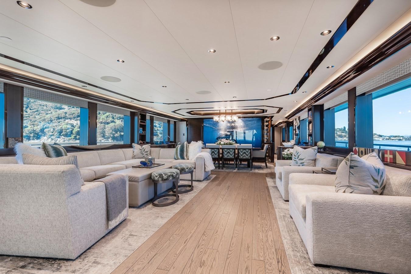 a living room with a large screen aboard FIGARO Yacht for Sale