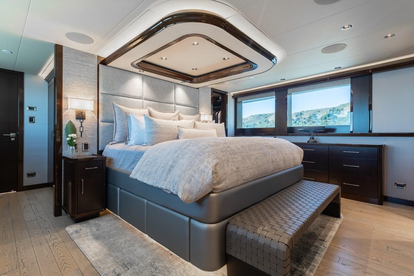 a bedroom with a large bed aboard FIGARO Yacht for Sale