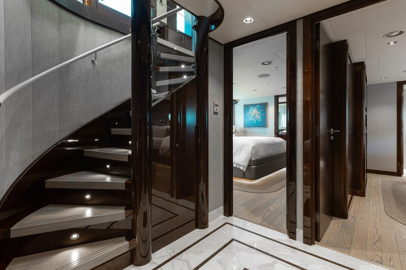 a room with a bed and a mirror aboard FIGARO Yacht for Sale