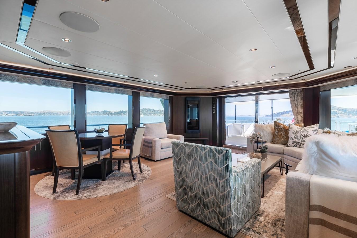 a living room with a large window aboard FIGARO Yacht for Sale