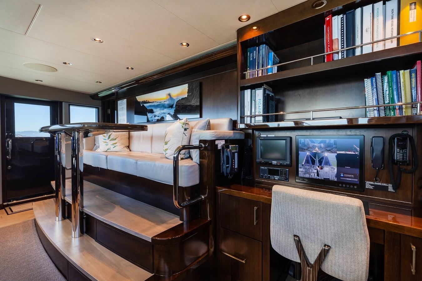 a room with a bed and a desk aboard FIGARO Yacht for Sale