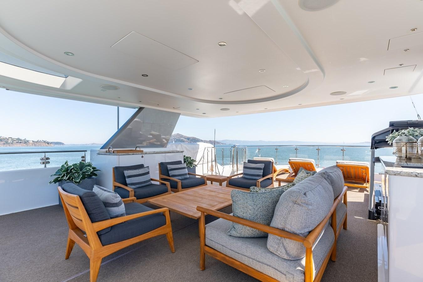 a room with chairs and a table aboard FIGARO Yacht for Sale