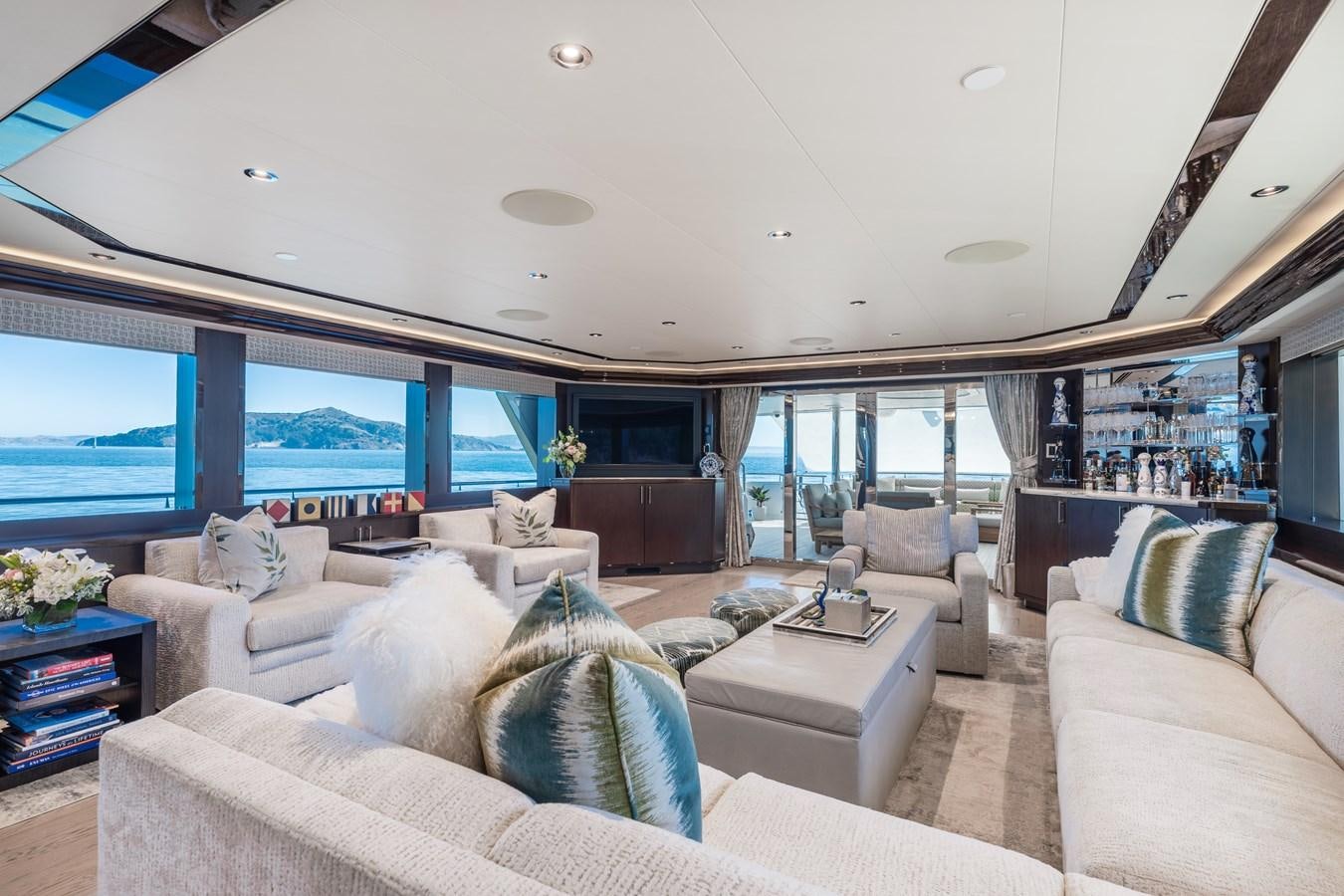 a living room with a large window aboard FIGARO Yacht for Sale
