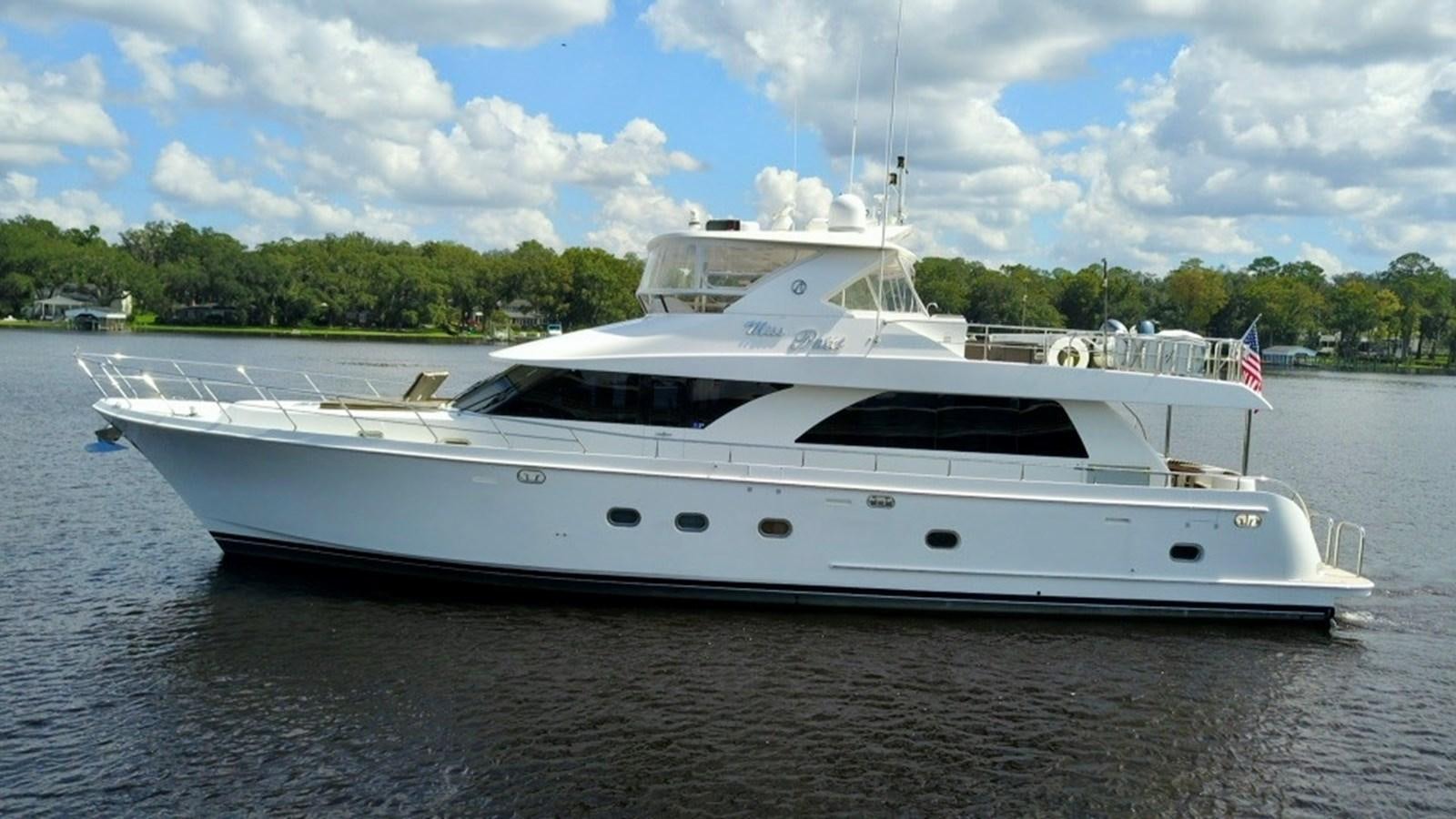 a white yacht on a beach aboard MISS PATTI Yacht for Sale