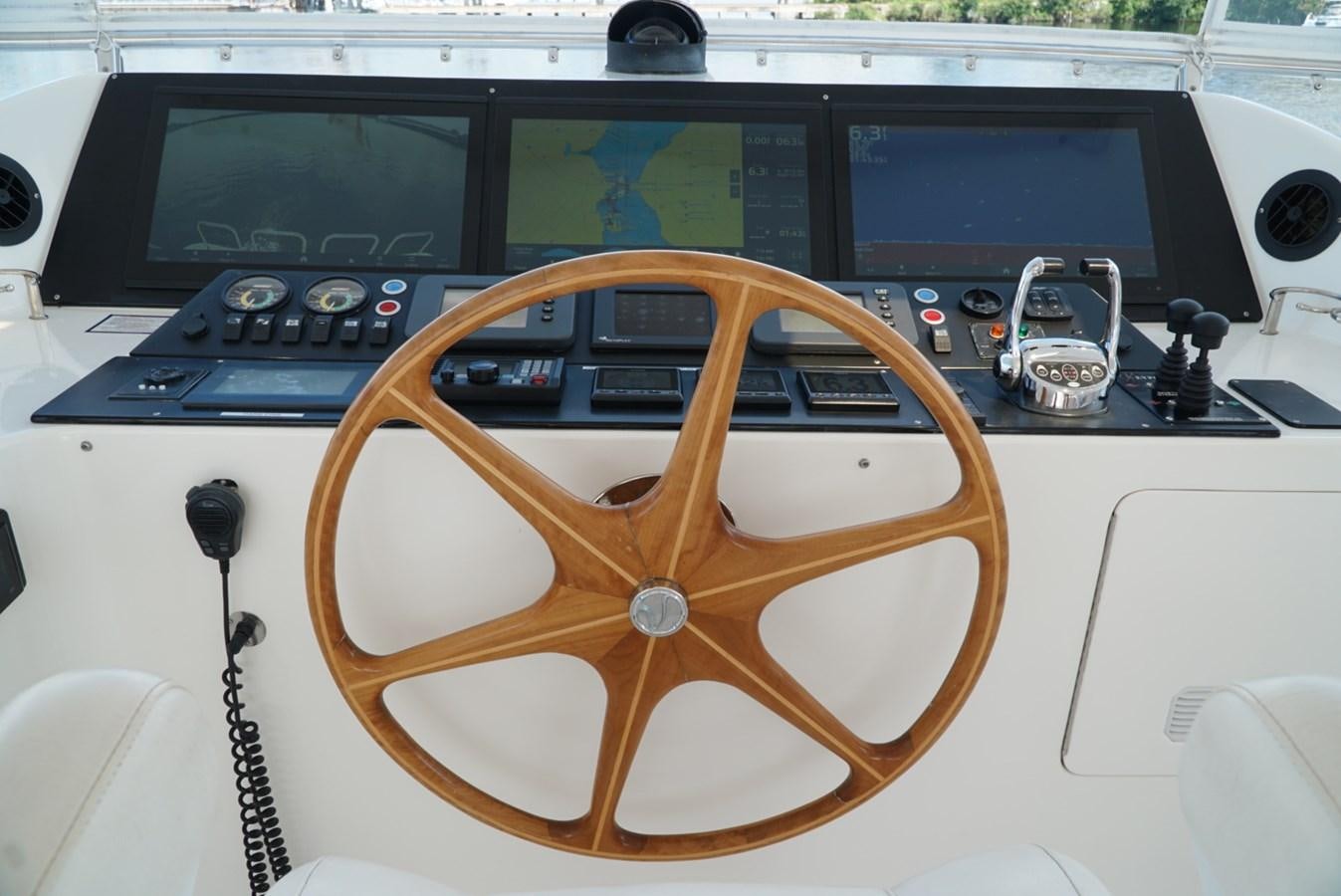 a wooden steering wheel aboard MISS PATTI Yacht for Sale