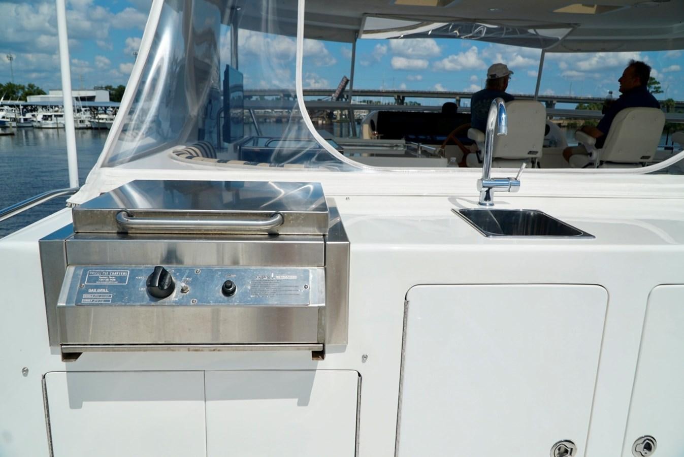 a boat with a person sitting on it aboard MISS PATTI Yacht for Sale