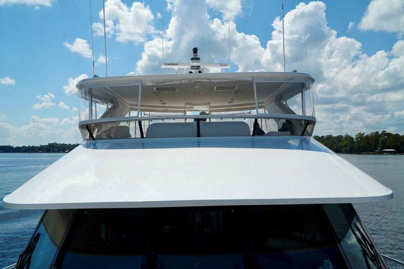 a white boat on a body of water aboard MISS PATTI Yacht for Sale