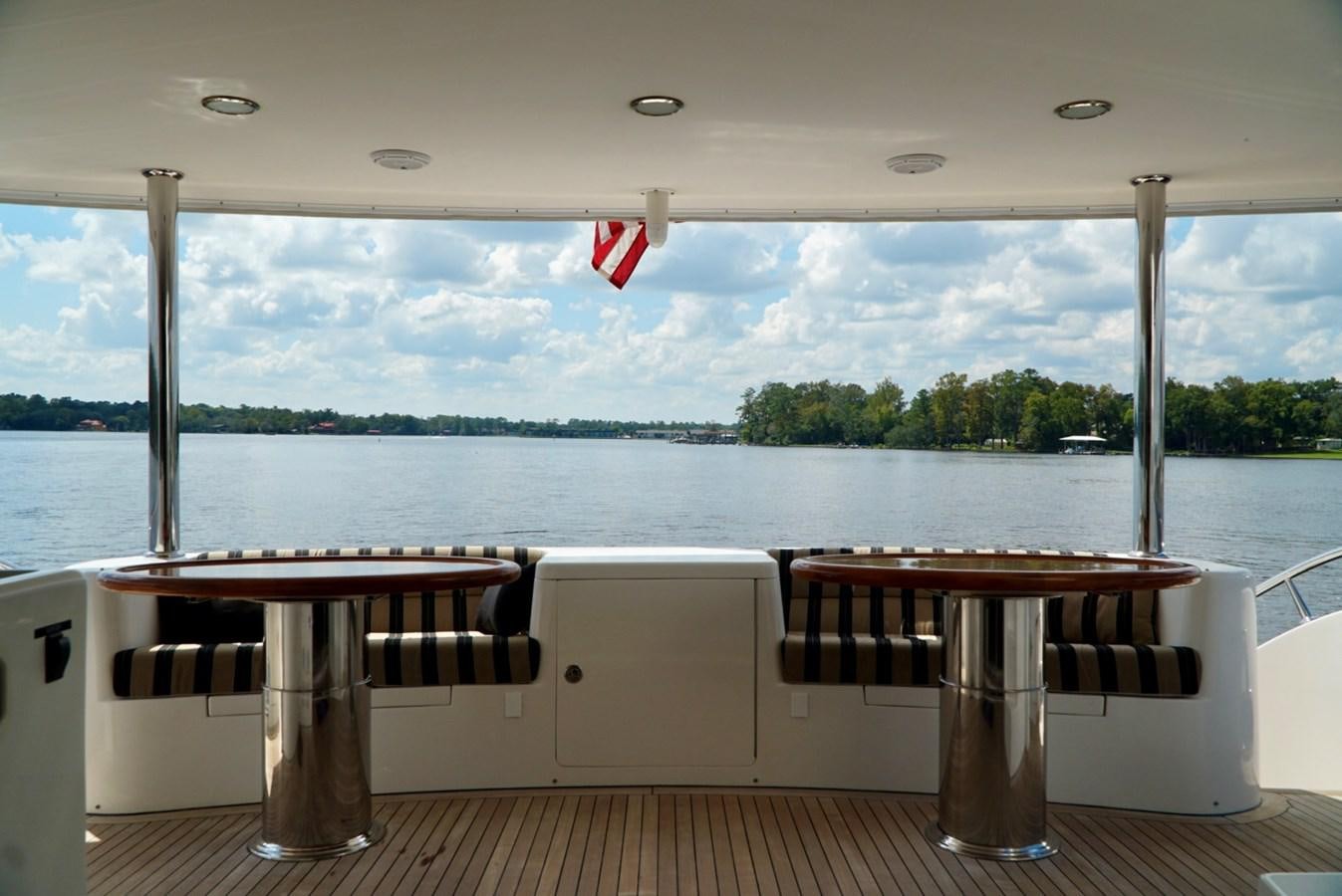 a table and chairs on a boat aboard MISS PATTI Yacht for Sale