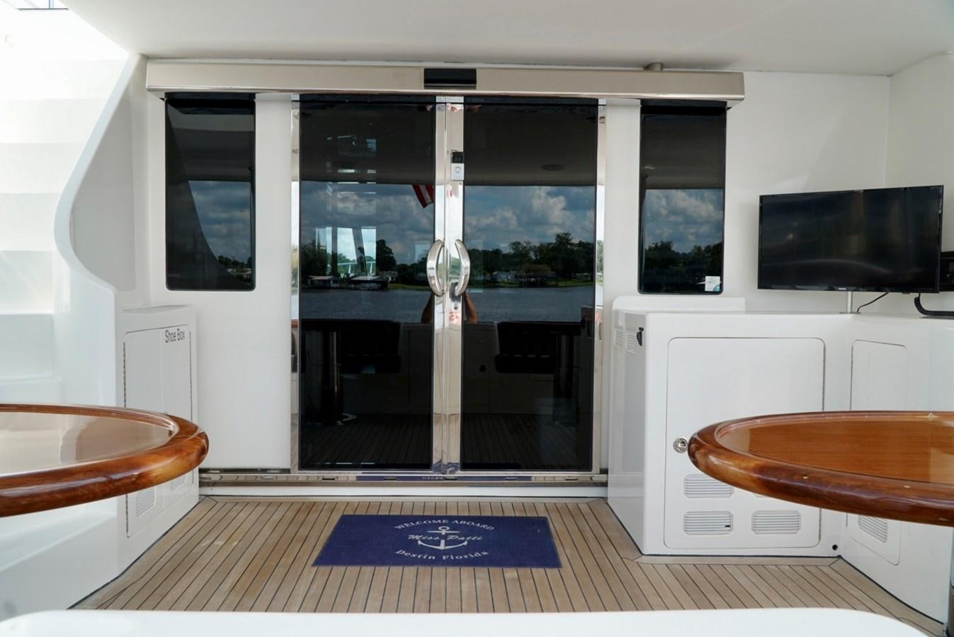 a kitchen with a glass door aboard MISS PATTI Yacht for Sale