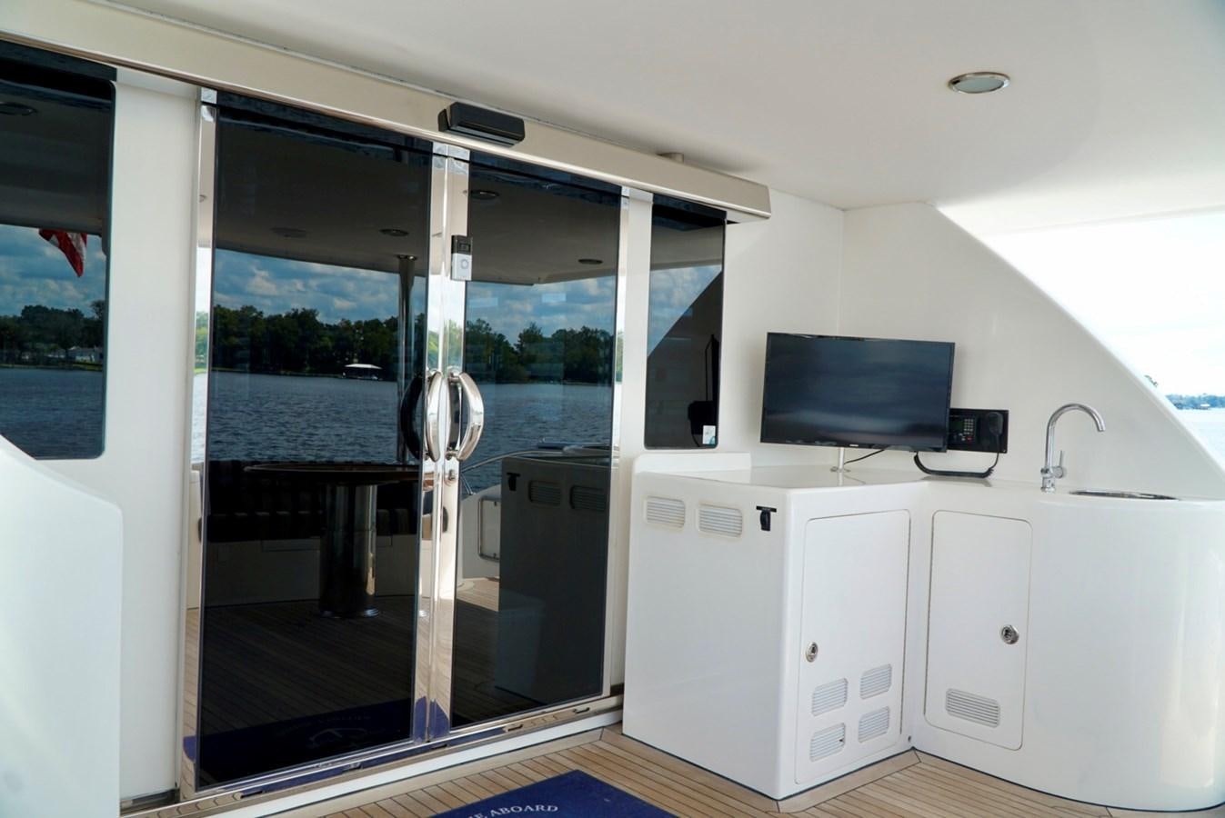 a kitchen with a sliding door aboard MISS PATTI Yacht for Sale