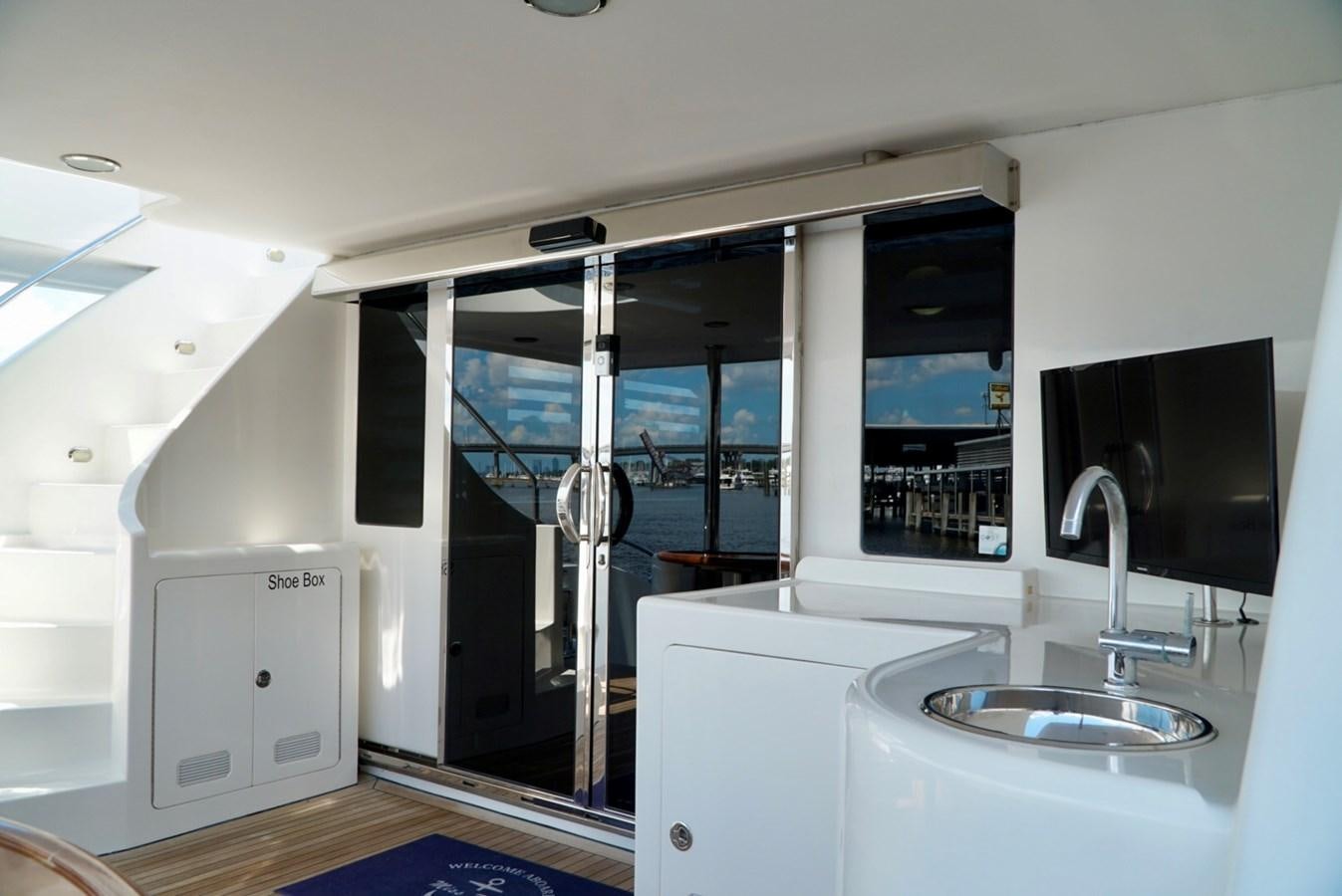 a bathroom with a sink and a large mirror aboard MISS PATTI Yacht for Sale