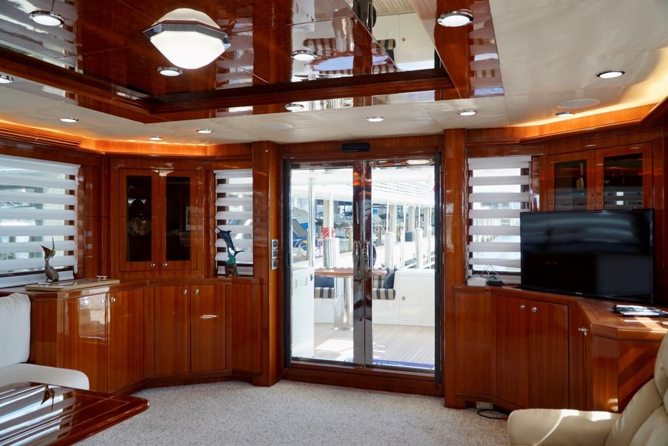 a room with wooden cabinets and a sliding glass door aboard MISS PATTI Yacht for Sale