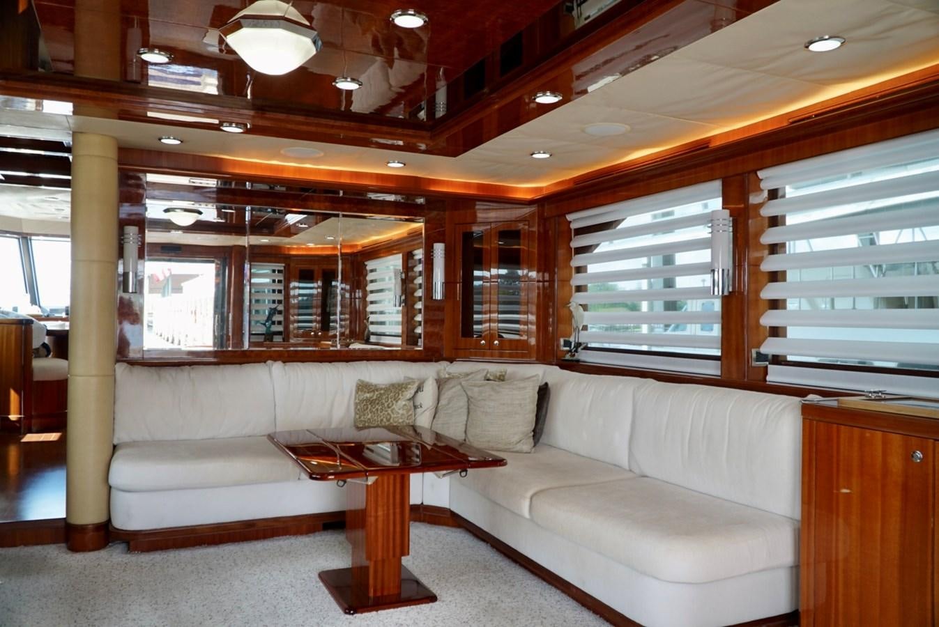 a living room with a couch and a coffee table aboard MISS PATTI Yacht for Sale
