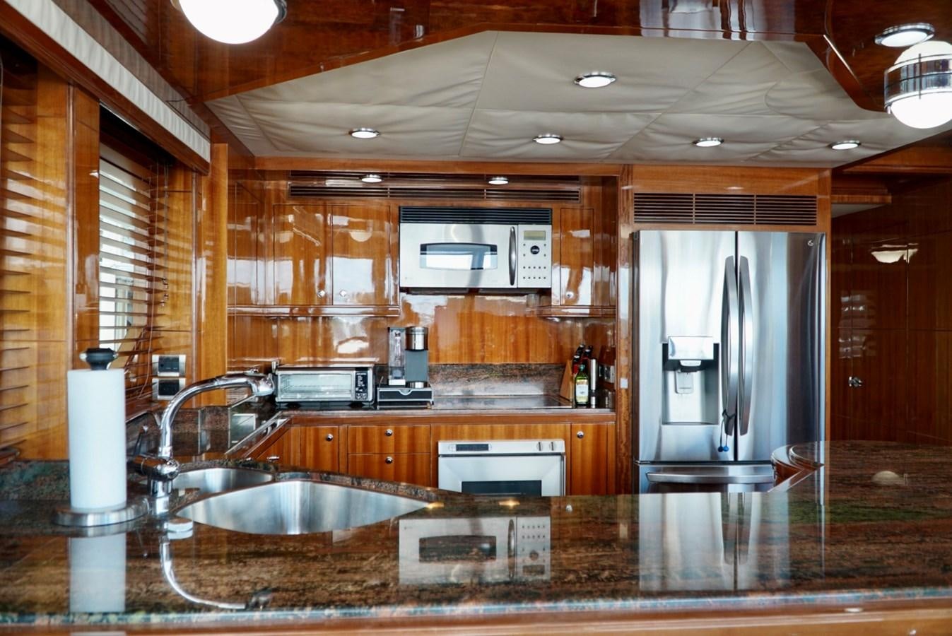 a kitchen with a large island aboard MISS PATTI Yacht for Sale