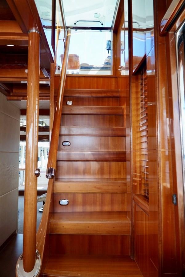 a wooden door with a glass window aboard MISS PATTI Yacht for Sale