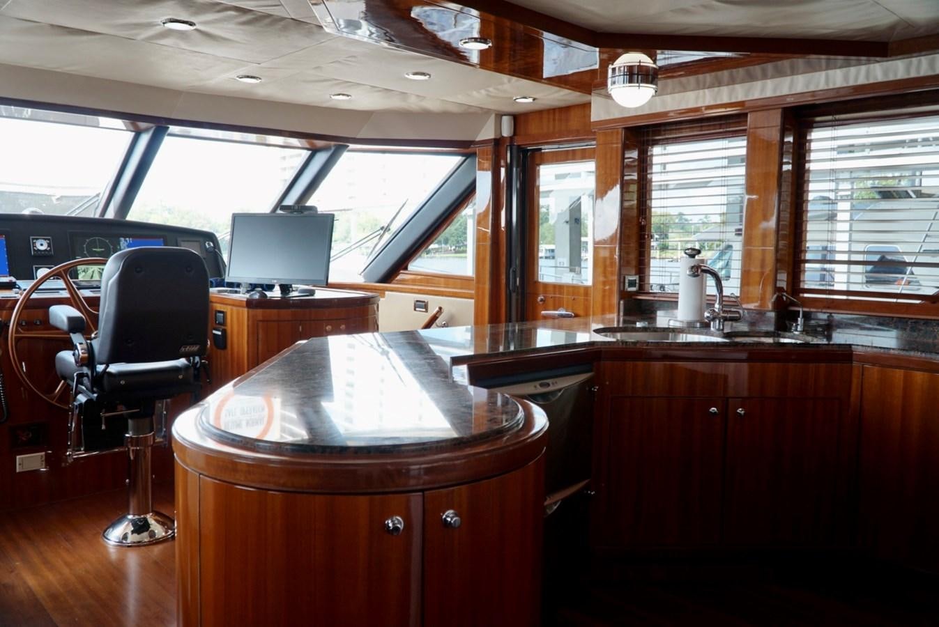 a bar with a table and chairs aboard MISS PATTI Yacht for Sale