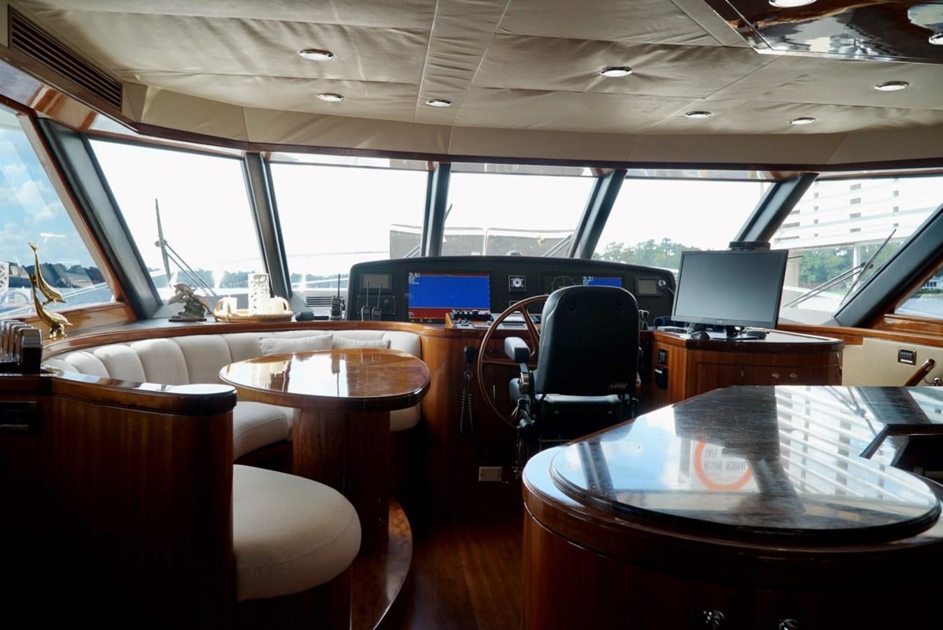inside of a vehicle with a table and chairs and a laptop on the table aboard MISS PATTI Yacht for Sale
