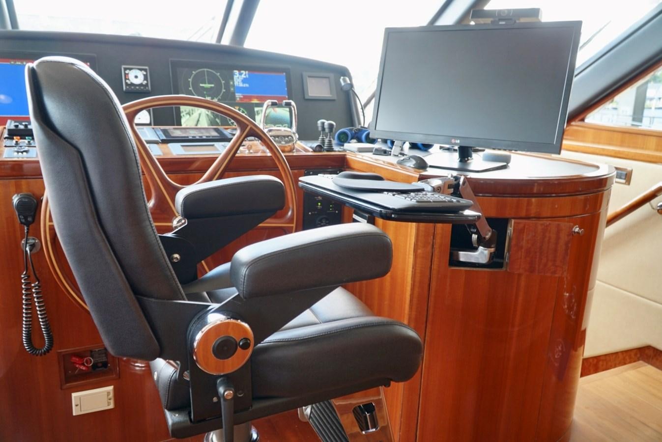 a desk with a computer and a chair aboard MISS PATTI Yacht for Sale