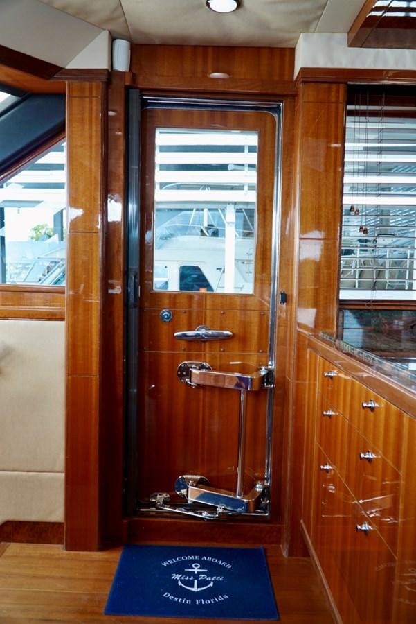 a wooden door with a window aboard MISS PATTI Yacht for Sale