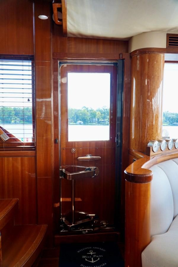 a bathroom with a large window aboard MISS PATTI Yacht for Sale