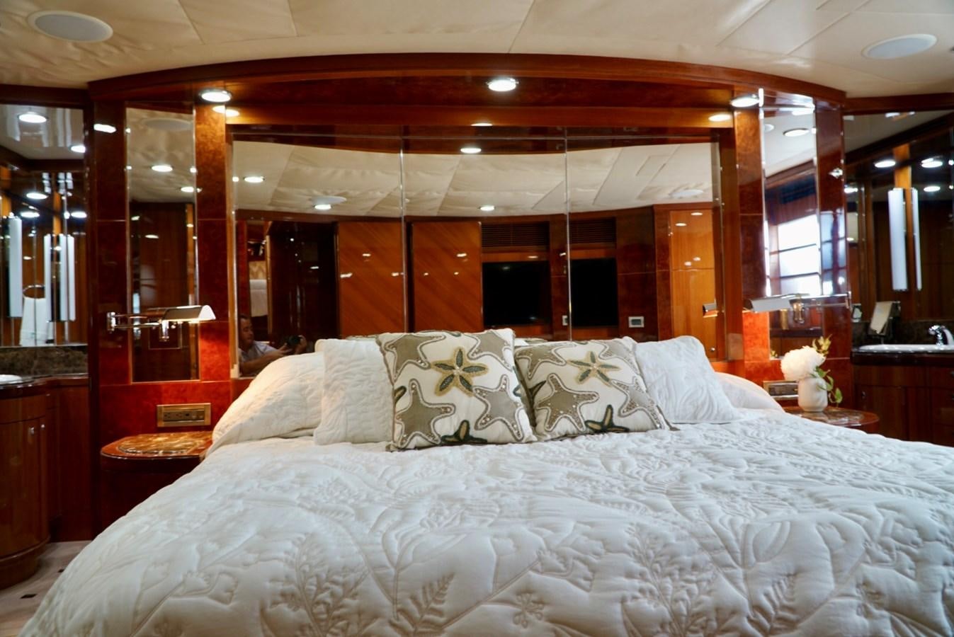 a bed with white sheets aboard MISS PATTI Yacht for Sale