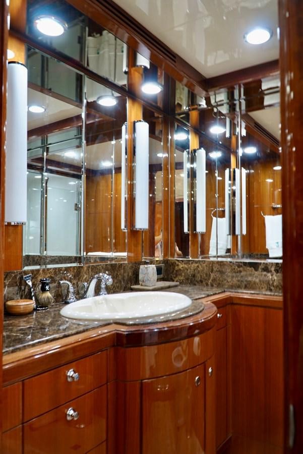a bathroom with a large mirror aboard MISS PATTI Yacht for Sale