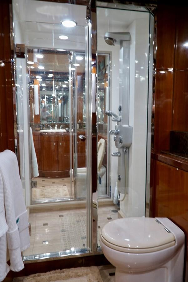 a bathroom with a glass shower aboard MISS PATTI Yacht for Sale