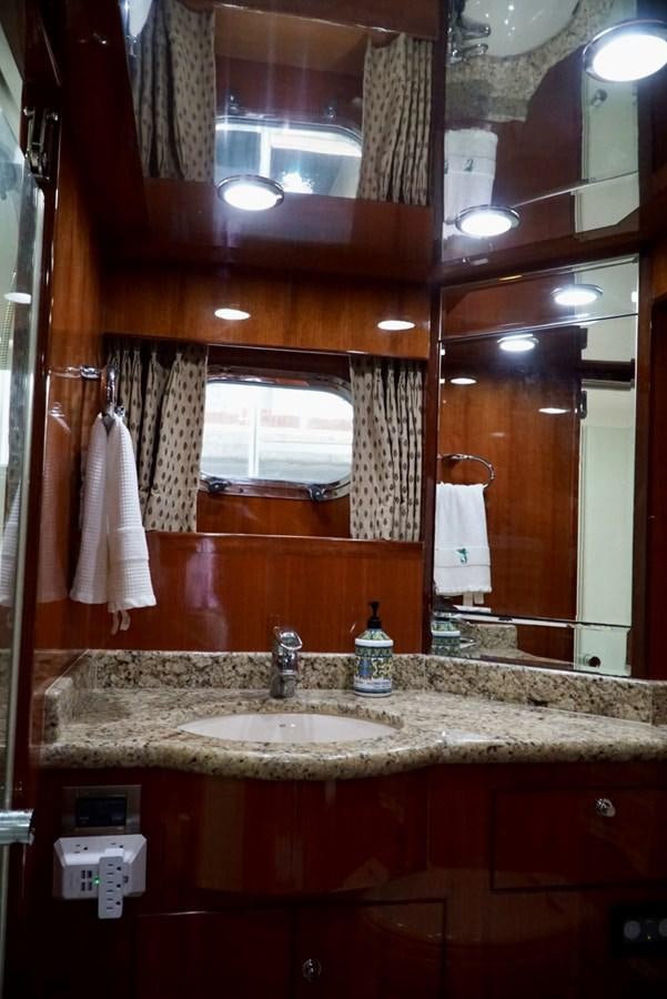 a bathroom with a sink and a mirror aboard MISS PATTI Yacht for Sale