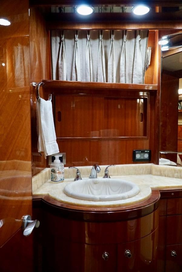a bathroom with a sink and a mirror aboard MISS PATTI Yacht for Sale