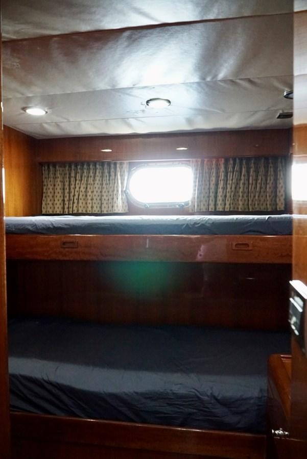 a room with a window and a bed aboard MISS PATTI Yacht for Sale