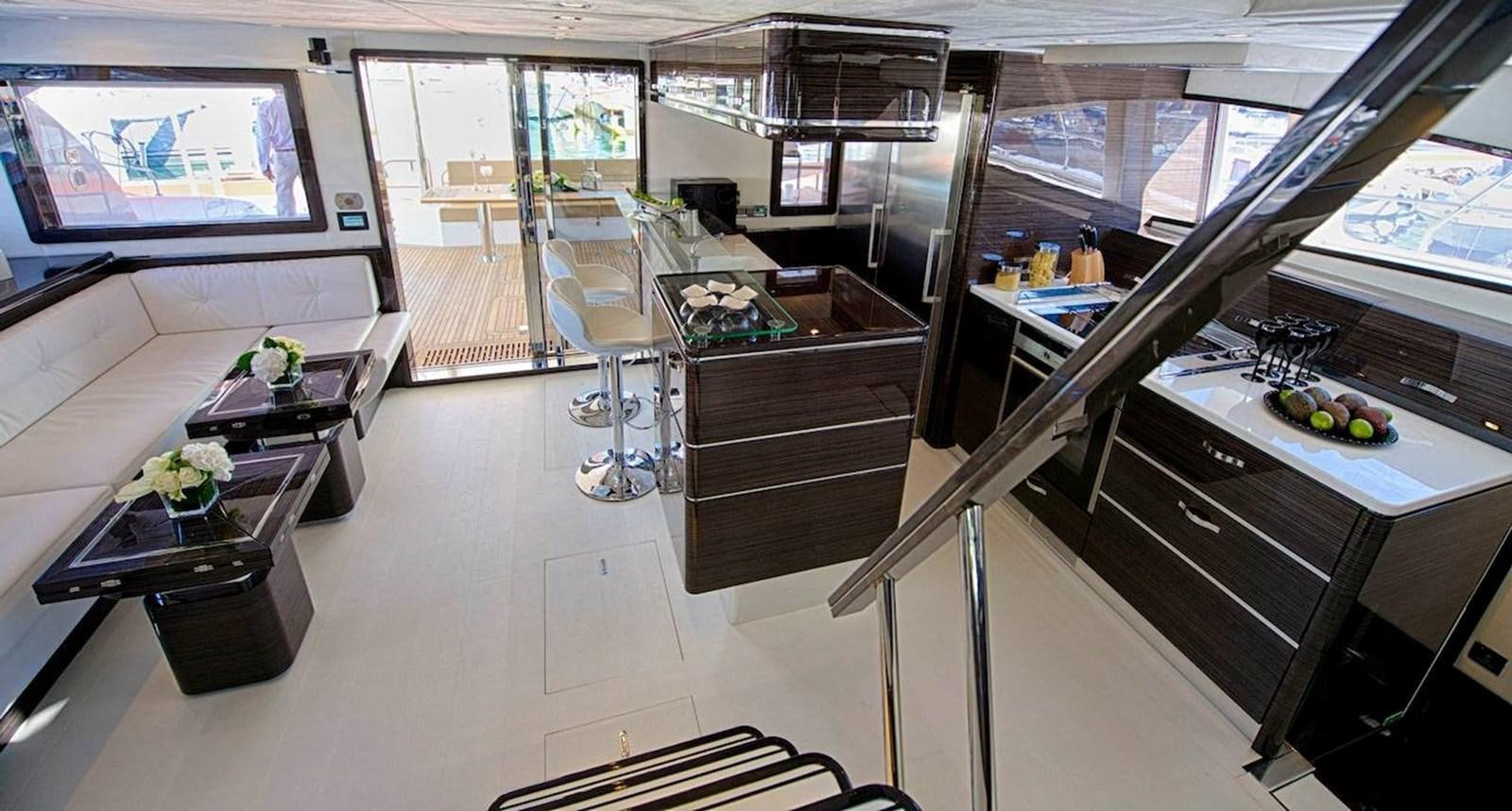 a kitchen with a glass wall aboard CLOUDS Yacht for Sale