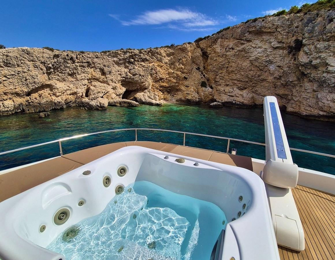 a bathtub in a swimming pool aboard CLOUDS Yacht for Sale