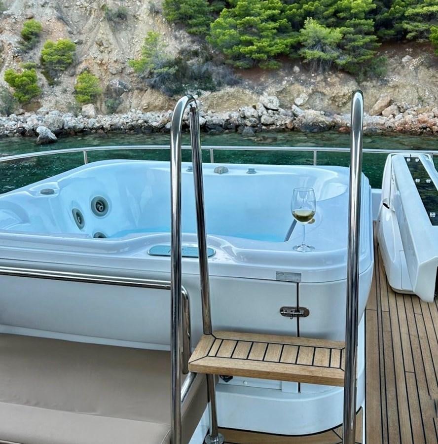 a bathtub and sink in a bathroom aboard CLOUDS Yacht for Sale