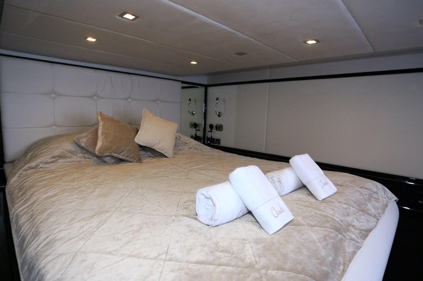a bed with pillows on it aboard CLOUDS Yacht for Sale
