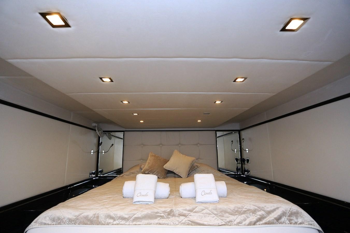 a bed in a room aboard CLOUDS Yacht for Sale